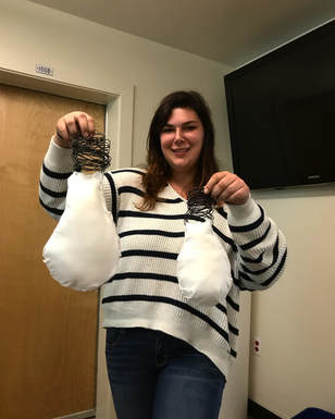 Picture of Dining coordinator Sarah Nolan made lightbulbs from wire and cotton in her sculpture class to raise awareness about Power Down HSU, September 2018
